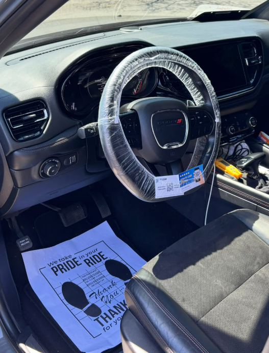 Dodge interior with protected steering wheel and floor mat