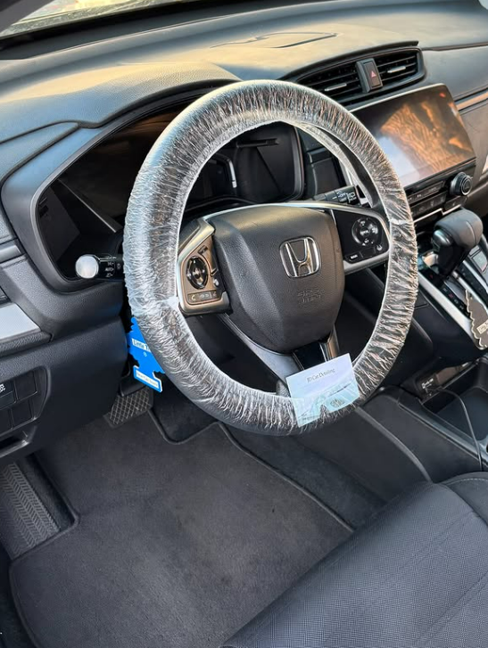 Honda interior with clean steering wheel and carpets
