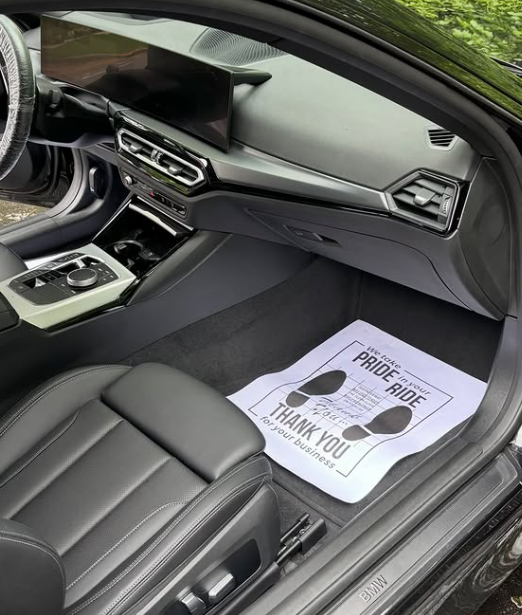 Spotless BMW front seats and center console after detailing