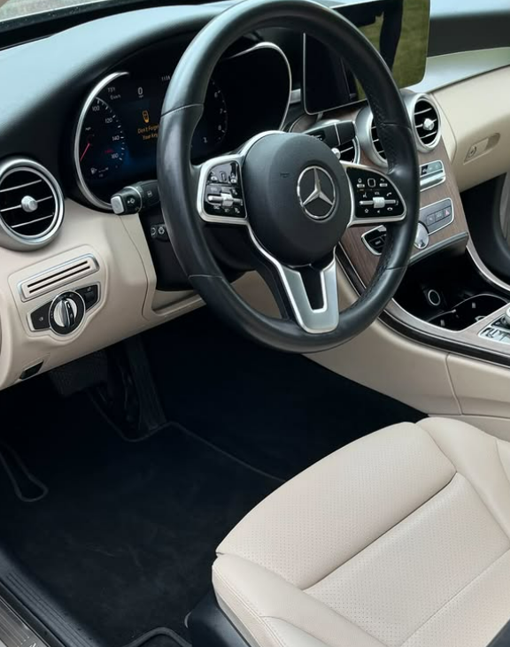 Mercedes cabin with cream leather seats and clean dashboard