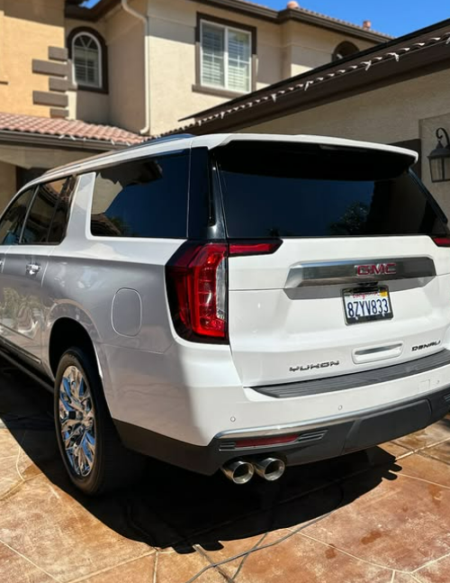 Shiny white GMC Yukon SUV after exterior detailing