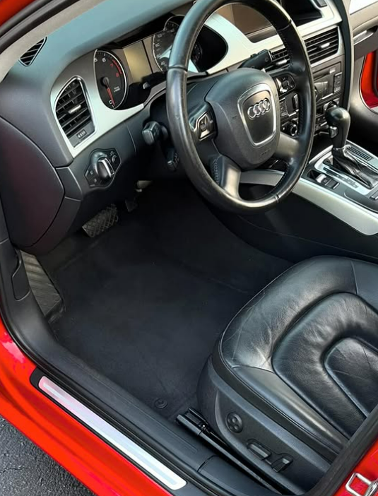 Audi interior with black leather and clean carpets
