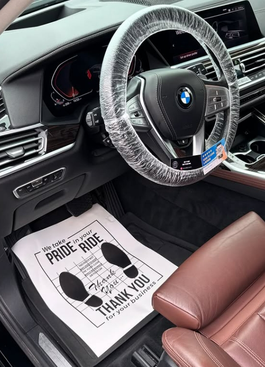 BMW interior with protected steering wheel and TrueShine thank-you mat
