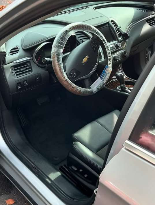 Chevy interior with wrapped steering wheel after a deep clean