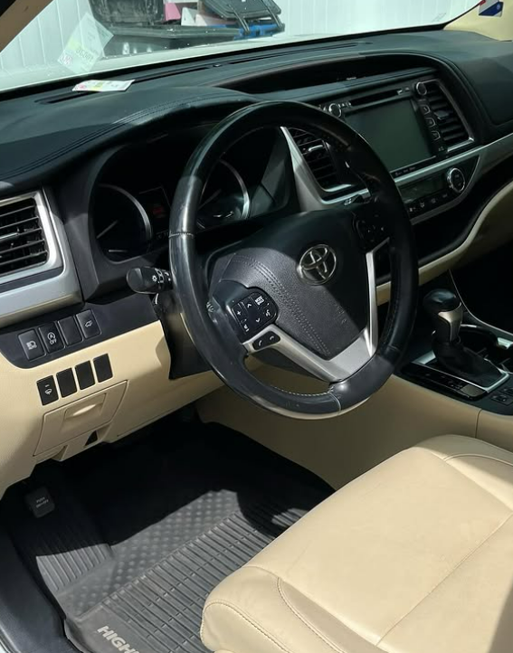 Toyota Highlander interior with clean tan leather seats